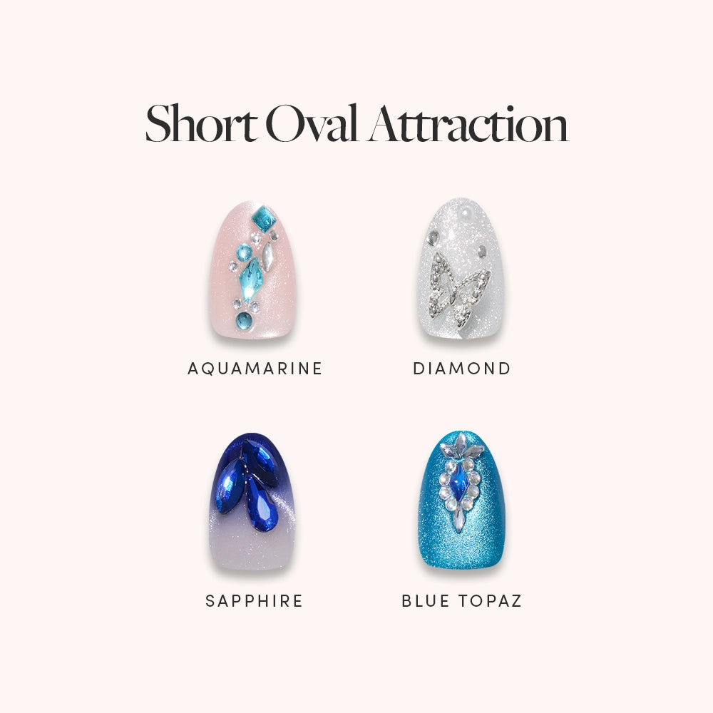 Glamnetic’s Short Oval Attraction set features four unique press-on nails: Aquamarine (pink with blue 3D gems), Diamond (white with silver gems), Sapphire (blue with dark blue gems), and Blue Topaz (teal blue with silver/blue gems).