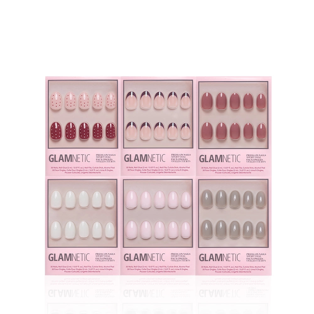 Six boxes of glamnetic Short Oval Semester press-on nail sets in an array of pink, red, and gray shades and designs are arranged in two rows against a white background. These salon-quality nails make it easy to achieve a long-lasting manicure at home. - Product image