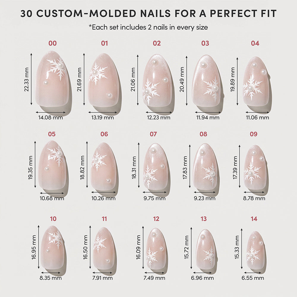 Experience the glamnetic Snowfall Press-On Nail Set—fifteen pairs of custom-molded, salon-quality artificial nails, each precisely labeled with its measurement in millimeters. These velvet-finish nails are arranged by size and feature elegant white snowflake designs on a nude pink base, combining charm and sophistication for any occasion. - Product image