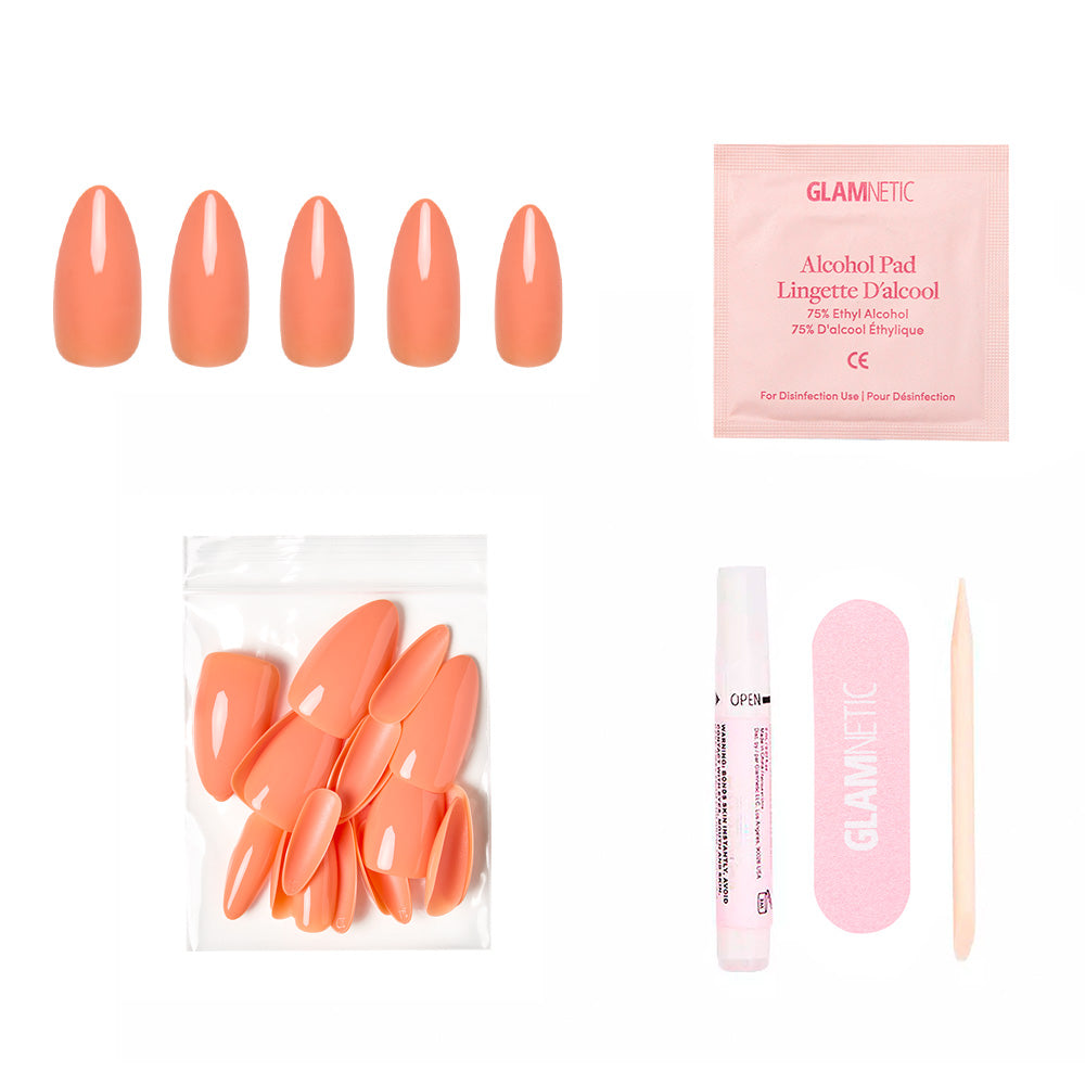 The glamnetic Soft Tangerine Nail Set includes pastel orange press-on nails, an alcohol pad, extra nails, nail glue, a pink nail file, and a wooden cuticle stick for salon-quality acrylics at home. - Product image