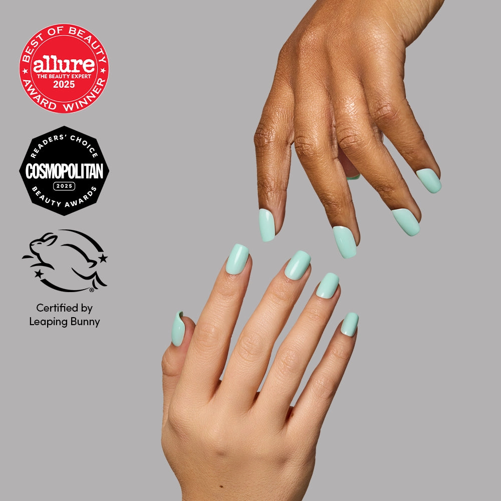 Hands with short, squoval nails in Soft Teal by glamnetic, shown alongside Allure Best of Beauty 2025, Cosmopolitan Readers Choice 2025, and Leaping Bunny certification logos.