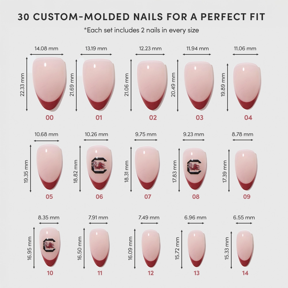 A chart displays 15 different sizes of the South Carolina Gamecocks Press-On Nail Set by glamnetic, each numbered and showing dimensions in millimeters. The pink nails feature red tips or decorative accents. - Product image