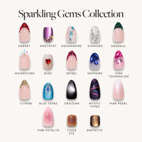 The Sparkling Gems Collection by glamnetic features 18 press-on nails, each with gemstone-inspired designs and names like Garnet, Amethyst, Aquamarine, Diamond, Emerald, and Moonstone.