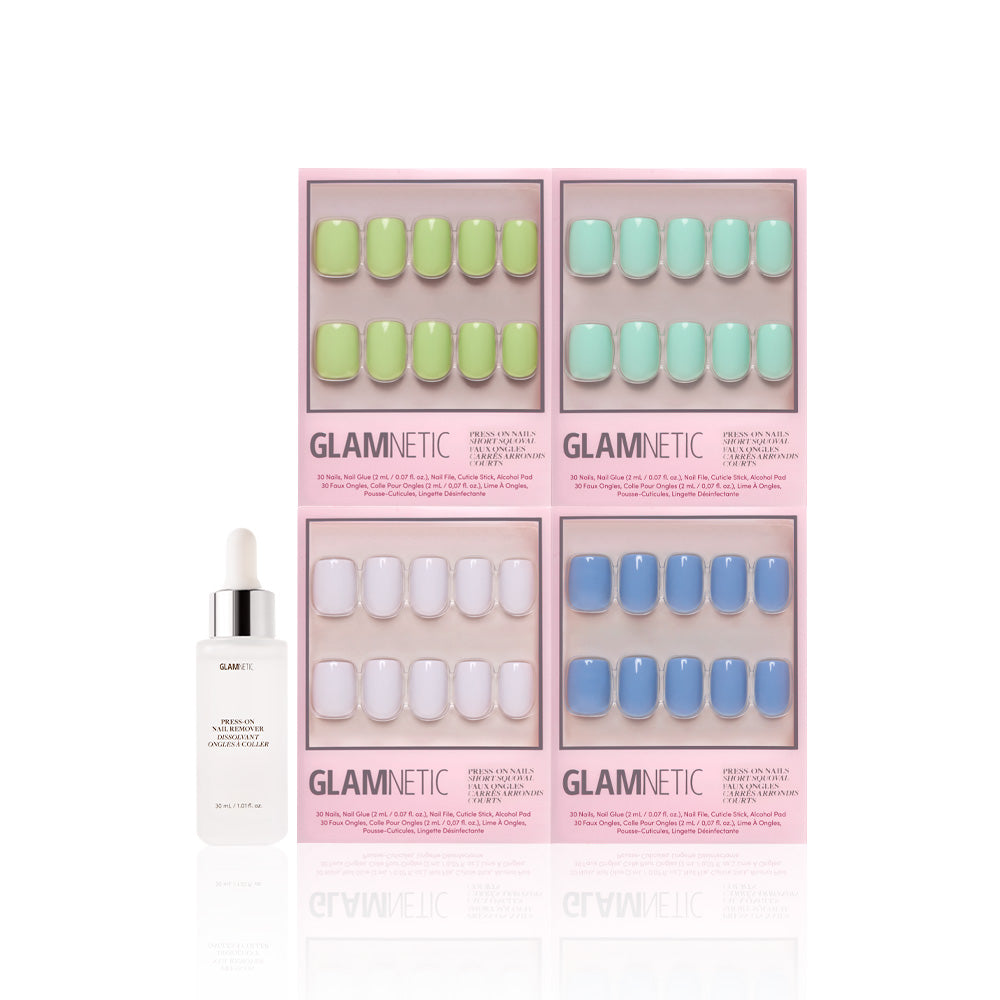 Four sets of glamnetic Spring Showers short squoval press-on nails in pastel green, yellow, mint, and blue with a glossy finish are displayed in pink boxes. A glamnetic brush-on nail glue bottle is placed in front. - Product image