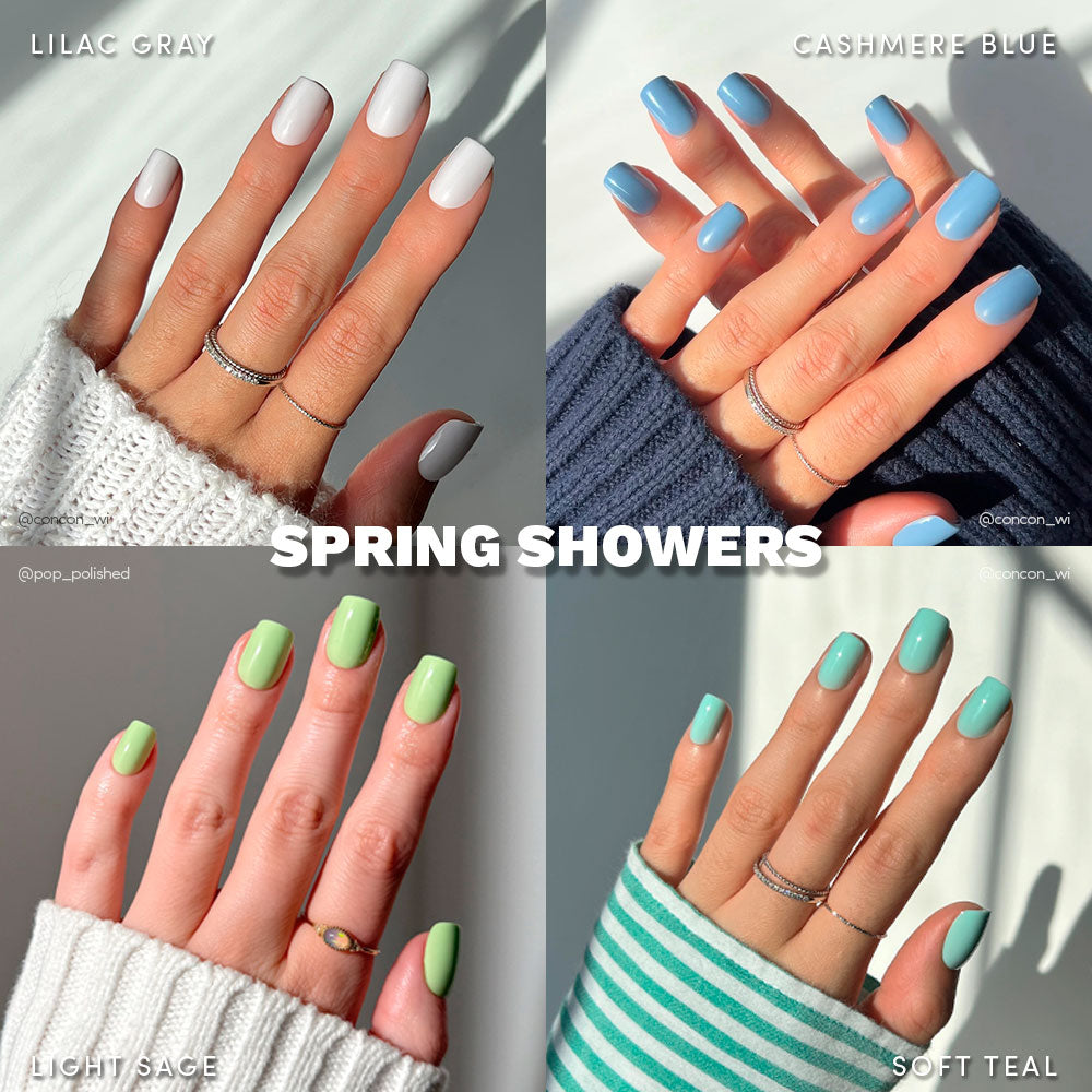 Four images of manicured hands with short squoval nails in pastel lilac gray, cashmere blue, light sage, and soft teal from glamnetic’s Spring Showers. Matching sweaters accent the glossy finish and centered “SPRING SHOWERS” text.