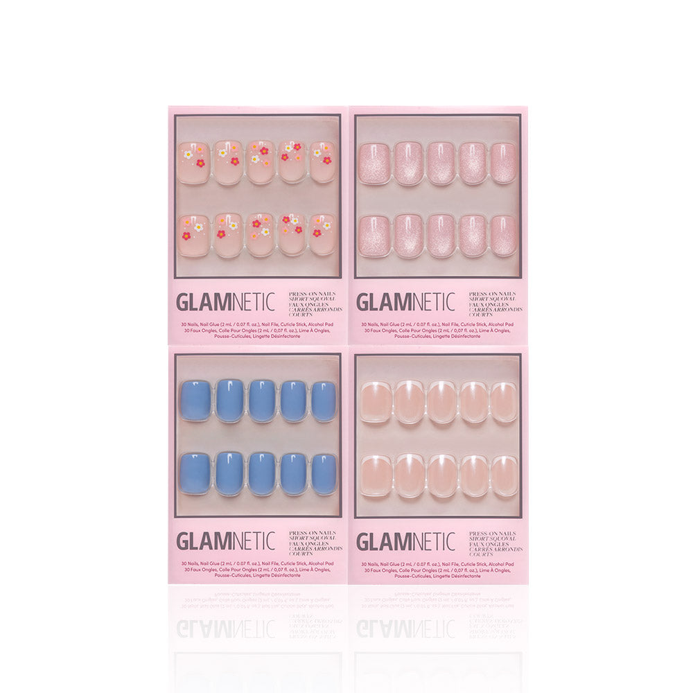 Four sets of glamnetic Springtime Squovals feature colorful floral, pink glitter, solid blue, and nude designs—each in its own pink package; salon-quality short squoval nails perfect for spring. - Product image