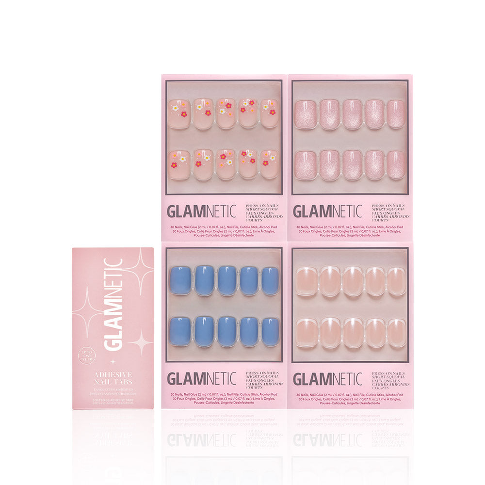Four boxes of glamnetic Springtime Squovals press-on nails—featuring floral, blue, glitter pink, and nude pastel designs—arranged with their packaging. Perfect for easy salon-quality spring nails at home. - Product image