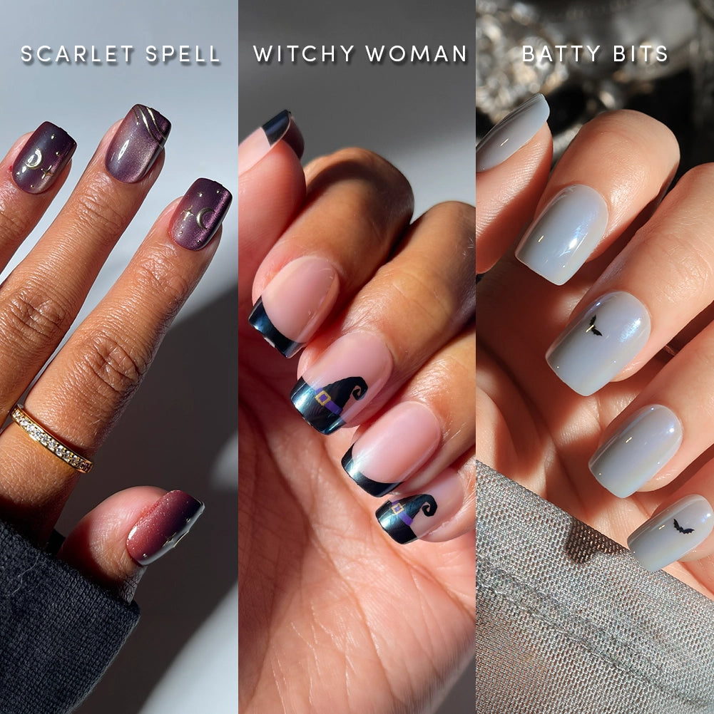 Three manicured hands: left with maroon Squoval Spellbook press-on nails from glamnetic featuring gold moon designs, center with salon-quality dark French tips and swirls (also from the Squoval Spellbook collection), and right with pale blue short squoval nails adorned with tiny bat art—all by glamnetic.