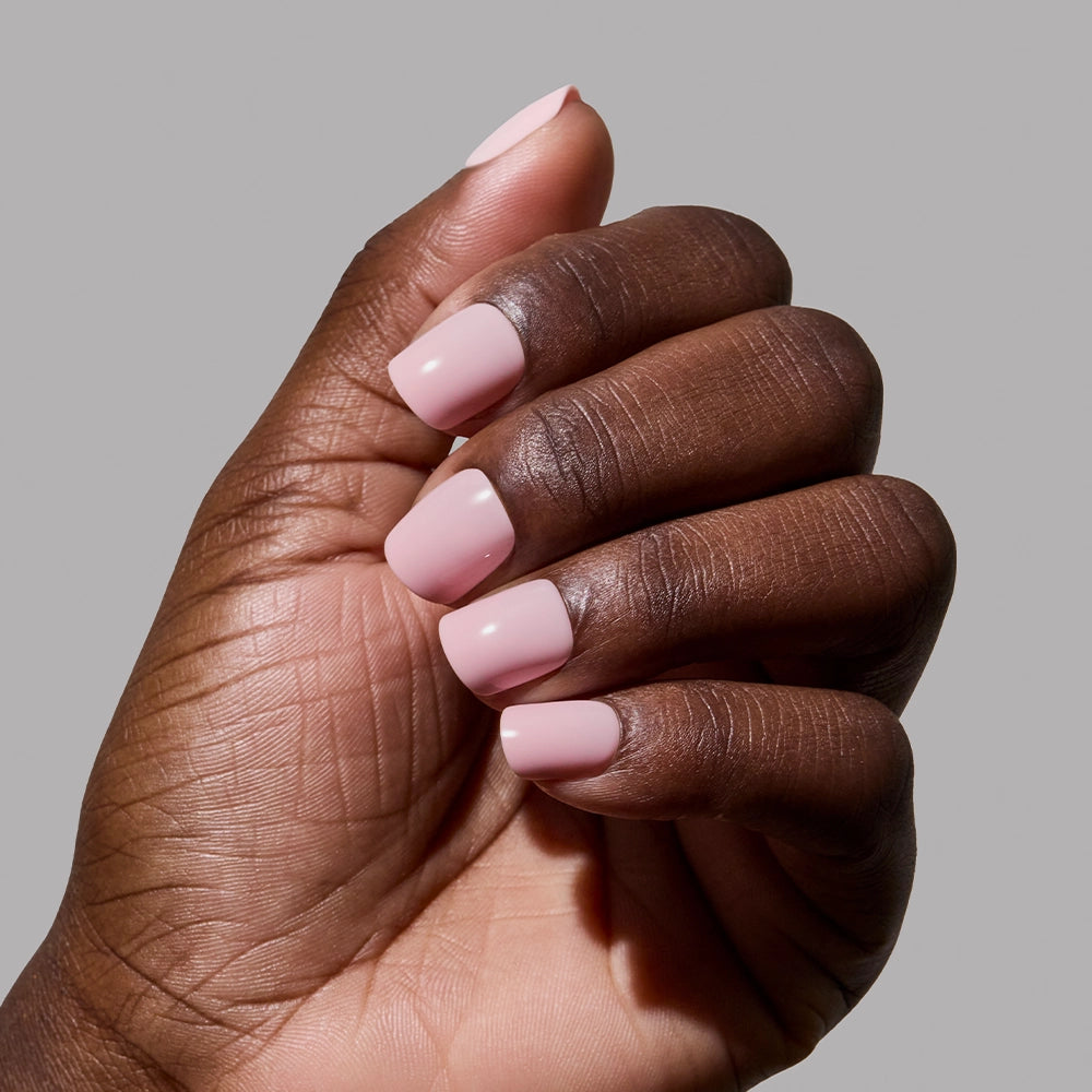 A hand with super short nails shows off a classic pink mani using glamnetic’s Sugar BB. - Product image