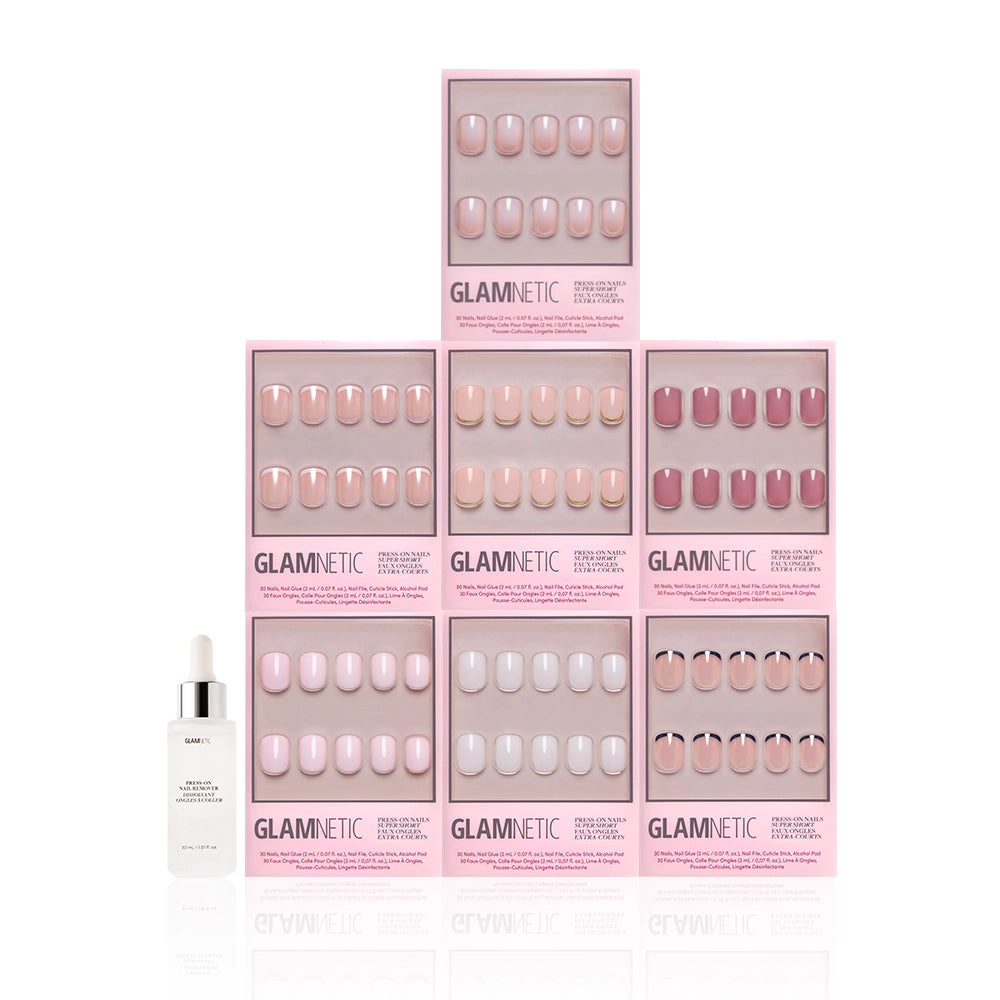 A pyramid display of nine glamnetic Super Short Icons press-on nail sets in nude and pink shades, featuring milky and French tip styles in pink packaging. A dropper bottle is placed at the bottom left. - Product image