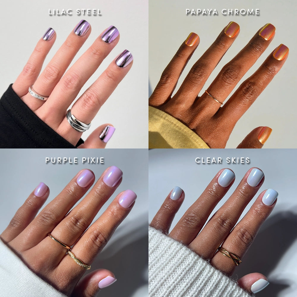 Four hands showcase different glamnetic Super Short Spark Notes press-on nail styles—including lilac metallic chrome, papaya orange chrome, pastel purple, and light blue shades. Each mani is paired with minimalist rings and contrasting sleeve colors for a chic touch, delivering a salon-quality look that elevates even the shortest press-ons.