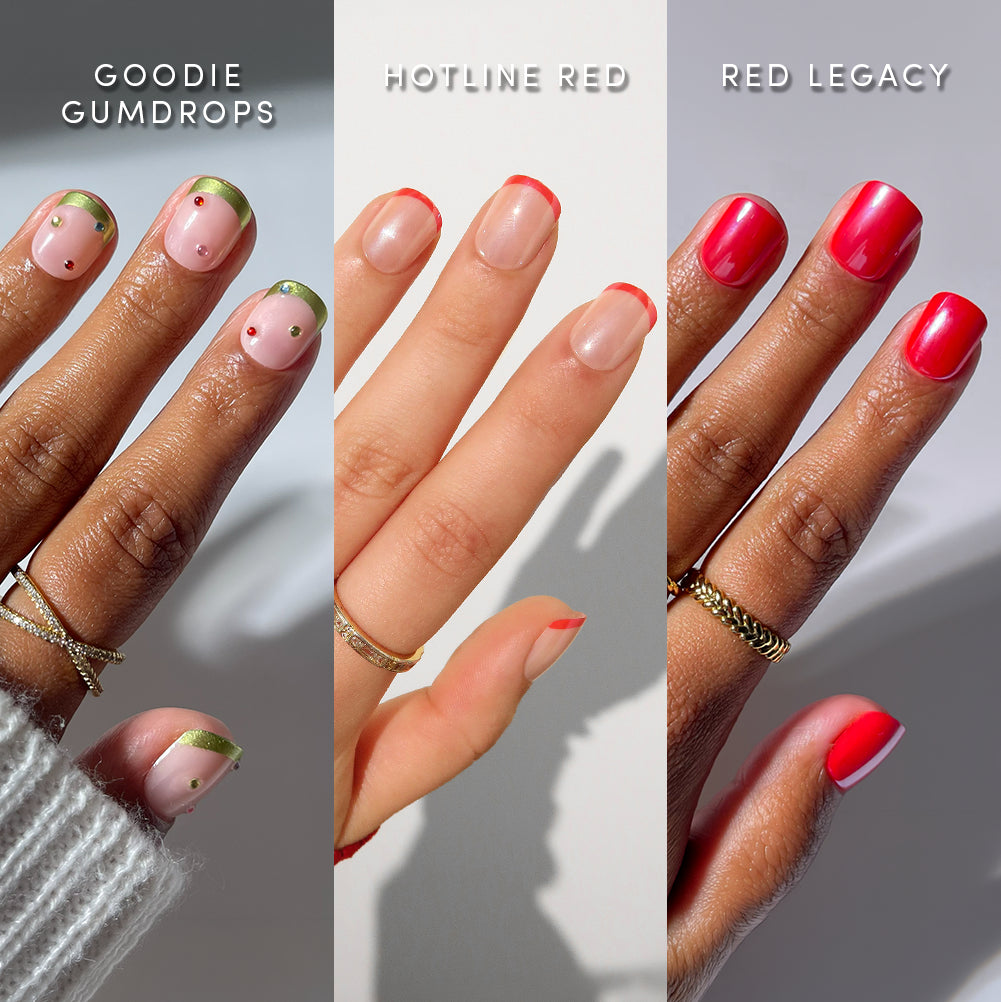 Three hands display different nail designs: pink with green and gold tips, nude with red tips, and bright red polish. Each hand is adorned with gold rings and labeled as Goodie Gumdrops, Hotline Red, and Red Legacy. glamnetic’s Super Short Stop natural-looking press-on nails deliver salon-quality manis in ultra chic super short styles for an effortlessly stylish look. - Product image