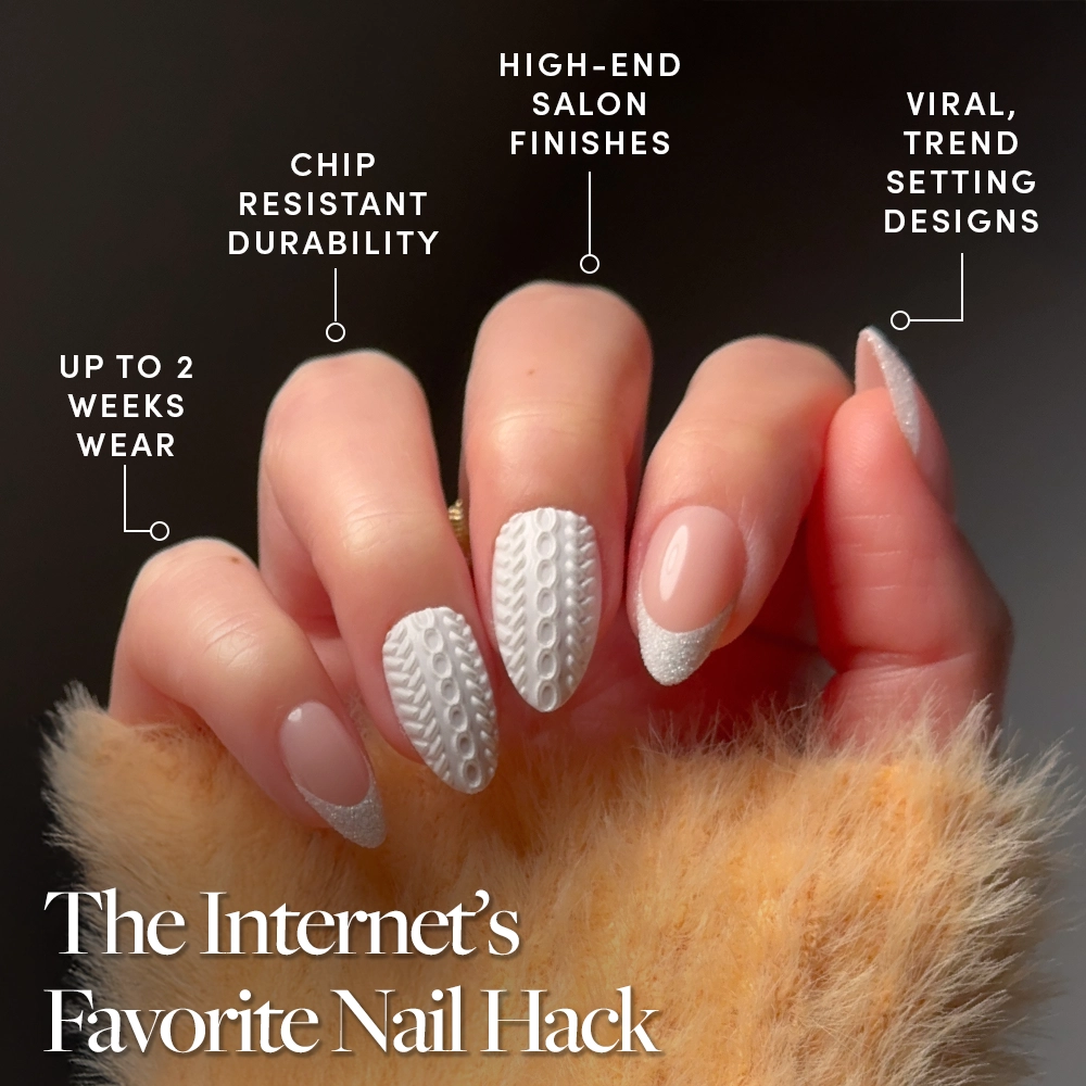 Clima de suéter - A hand displays glamnetic’s “Sweater Weather” press-on nails—long, almond-shaped with a textured white and nude base, finished in chic glitter French tips—while holding a fluffy orange accessory. Text emphasizes their durability, salon-quality finish, trendy design, and up to 2 weeks of wear.