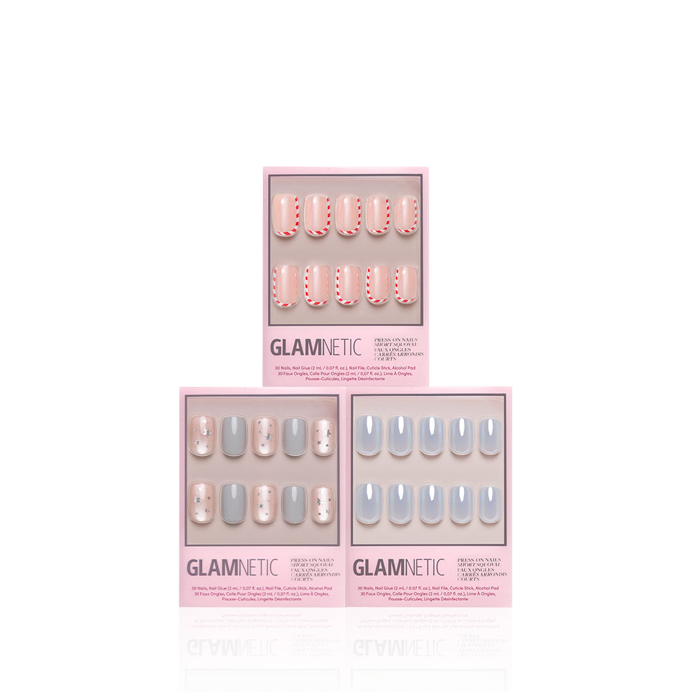 'Tis the Season of Squovals - Three sets of Glamnetic ’Tis the Season of Squovals salon-quality short squoval press-on nails in pink, white, and gray, each displayed in individual product boxes.