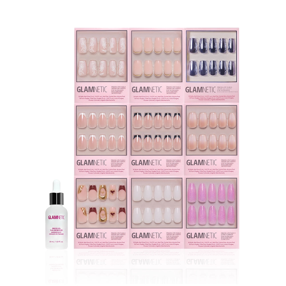Nine boxes of glamnetic The Coffin Vault press-on nails in assorted colors and neutral designs are arranged in a grid above a bottle of glamnetic Brush-On Nail Glue, all set against a white background. - Product image