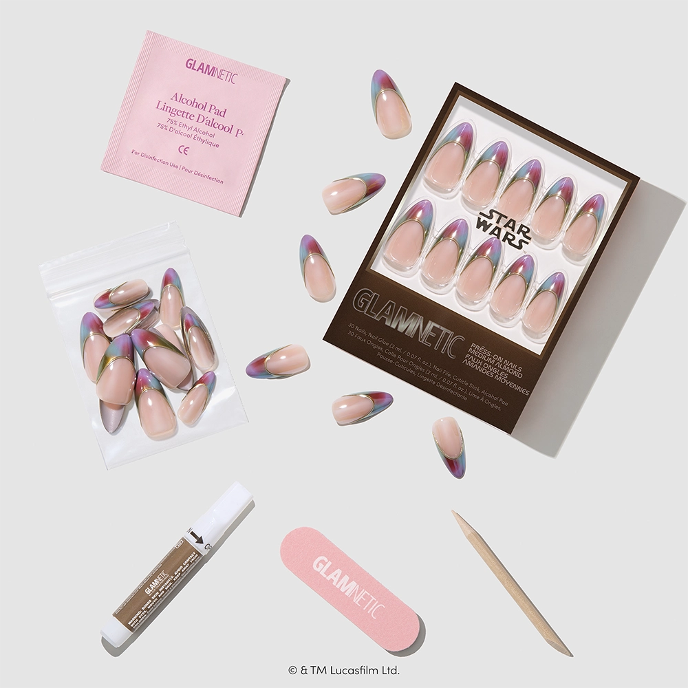 The Jedi Order - Glamnetic “The Jedi Order” Star Wars-themed almond press-on nail set with gradient tips, featuring an alcohol pad, nail glue, wooden cuticle stick, nail file, and extra nails arranged on a light background.