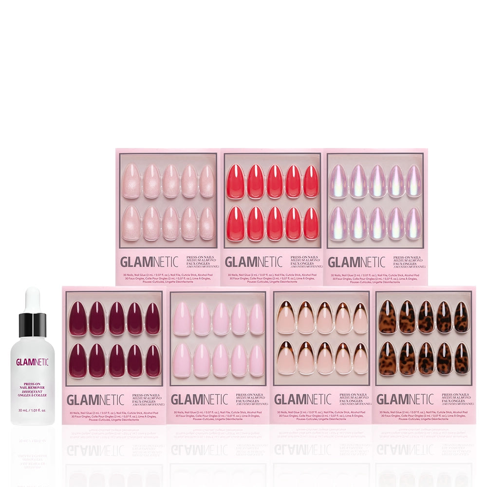 Eight boxes of glamnetic’s The Medium Almond Edit press-on nails in assorted colors and patterns are arranged in two rows, with a bottle of brush-on nail glue on the left—a must-have bundle for medium almond nail fans. - Product image