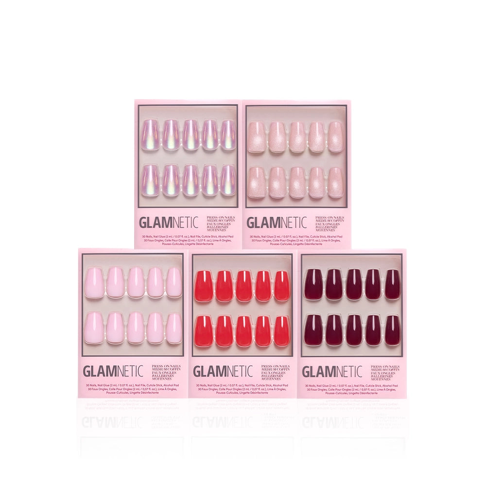 Five boxes of glamnetic’s The Medium Coffin Edit press-on nails are arranged in two rows, showing sculpted pink, red, and nude shades with glossy and shimmery finishes on a white background.