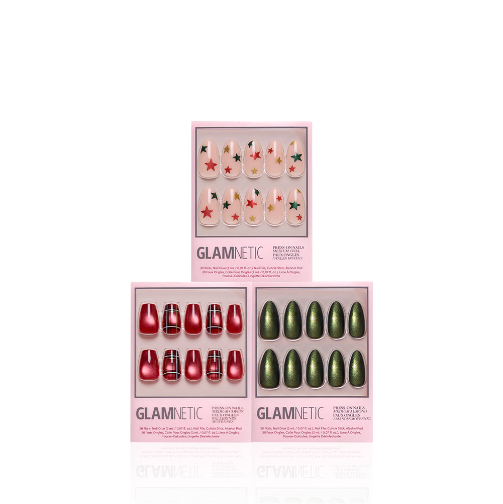 The Merry Mediums - The Merry Mediums holiday nail bundle featuring medium length press-ons: one set with a nude base and green star print, one in solid glossy red, and one in solid metallic green.