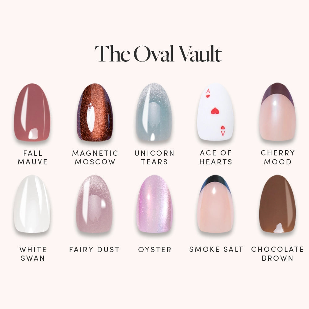 Glamnetic’s The Oval Vault showcases ten short oval press-on nails in two rows, each set labeled with names like Fall Mauve, Unicorn Tears, Ace of Hearts, and Chocolate Brown in various colors and finishes.