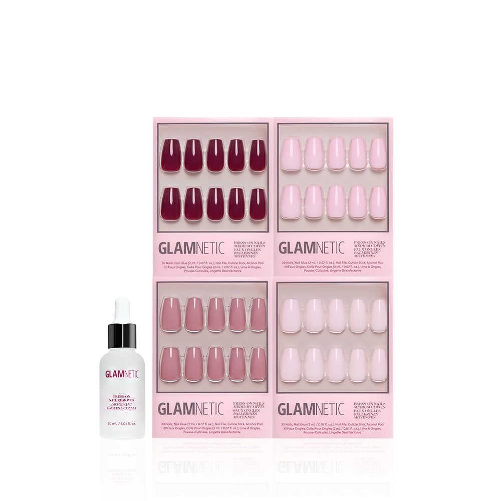 A set of four Glamnetic The Pink Medium Coffin Icons press-on nail boxes in pink and red tones is arranged above a small dropper-capped bottle of Glamnetic nail glue, all displayed on a white background. - Product image