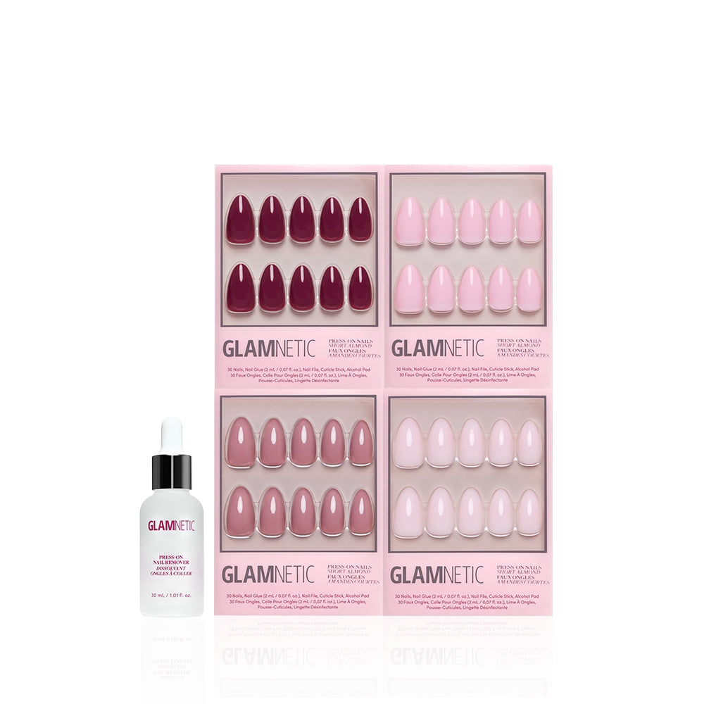 A box labeled glamnetic holds The Pink Short Almond Icons, featuring four trays of glossy nails in pink and mauve shades, next to a glamnetic nail glue bottle with a dropper cap. - Product image