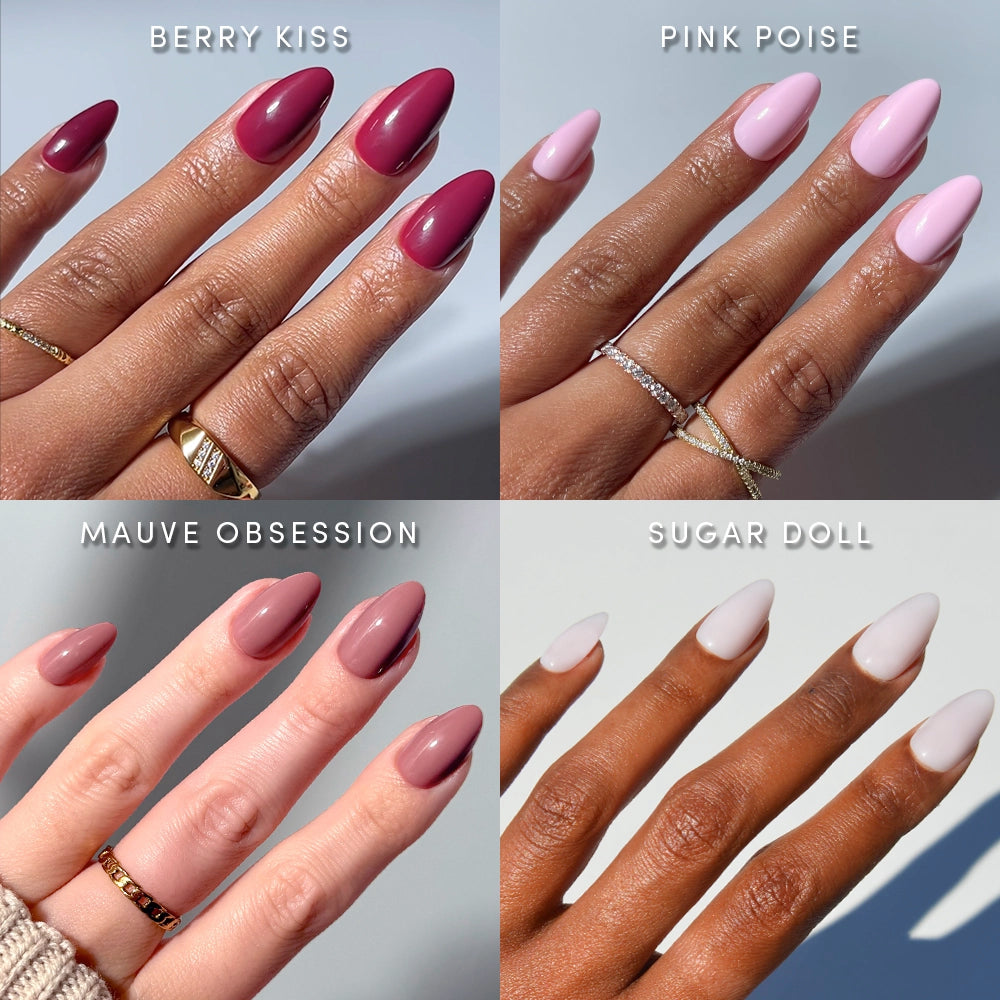 Four hands with glamnetic's The Pink Short Almond Icons press-ons—Berry Kiss (dark berry red), Pink Poise (light pink glossy), Mauve Obsession (mauve), and Sugar Doll (pale nude)—shine against a light background.
