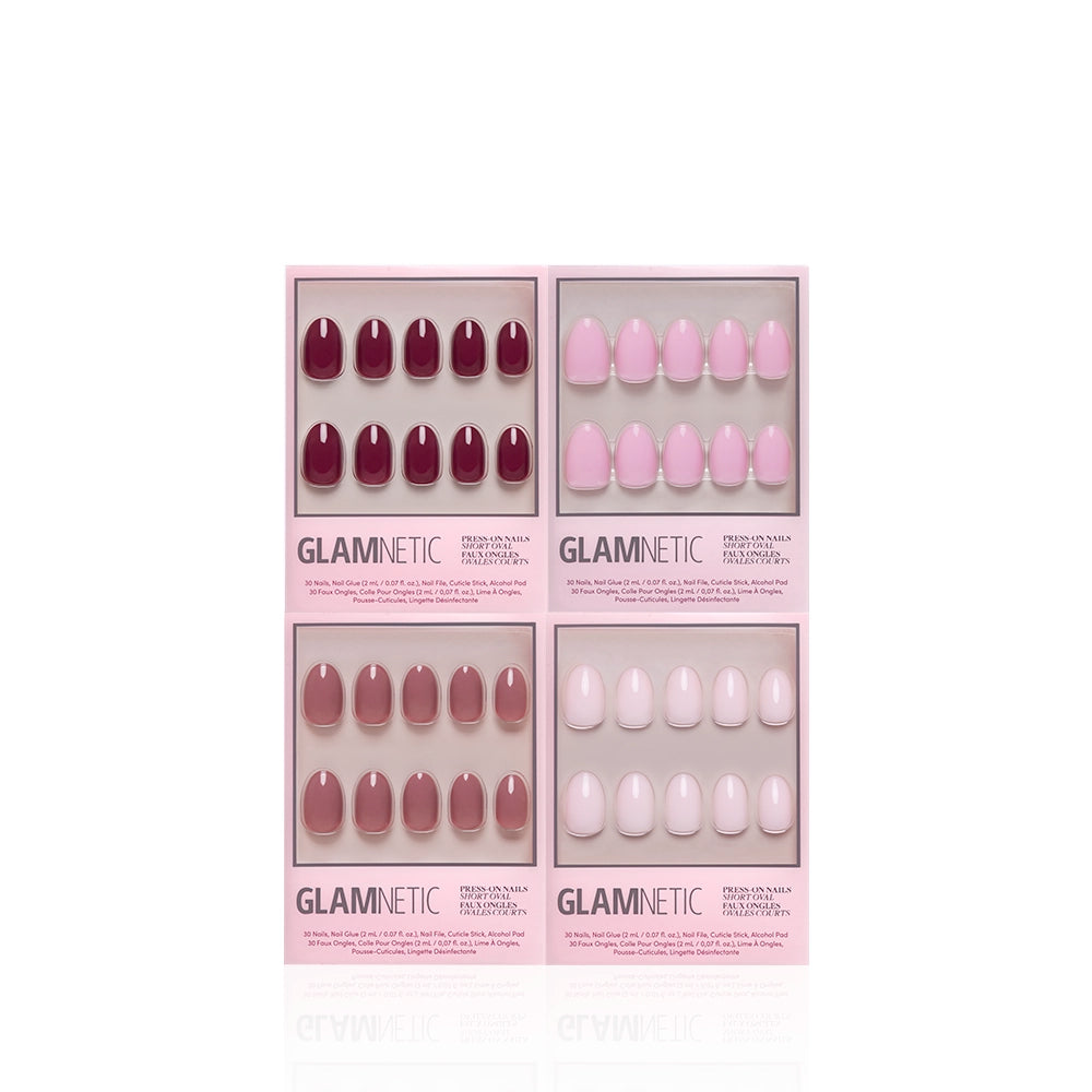 Four boxes of glamnetic’s The Pink Short Oval Icons are neatly arranged on a white background, each displaying glossy pink press-on nails through a clear window. - Product image