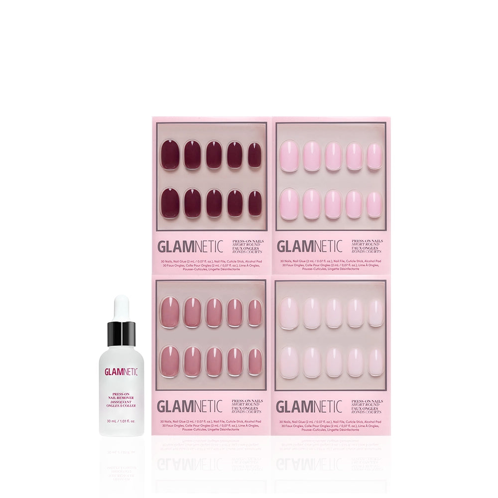 The Pink Short Round Icons by glamnetic: four boxes of glossy pink short round press-on nails, arranged in a square with a Glamnetic nail glue dropper bottle on the left, all displayed on a white background. - Product image