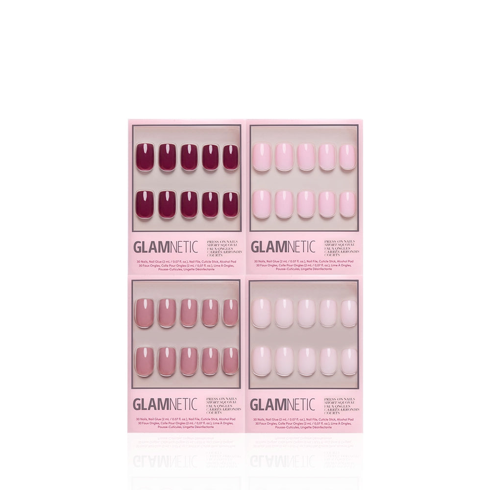 Four boxes of glamnetic's The Pink Short Squoval Icons press-on nails in different pink and mauve shades, arranged on a white background. Each box features a full set of short squoval nails in one solid color. - Product image
