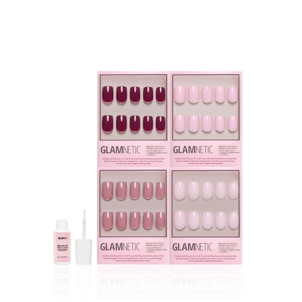 Four sets of The Pink Short Squoval Icons by glamnetic—glossy press-on nails in pink and mauve shades—are displayed in branded boxes with a nail glue bottle and brush on a white background. - Product image