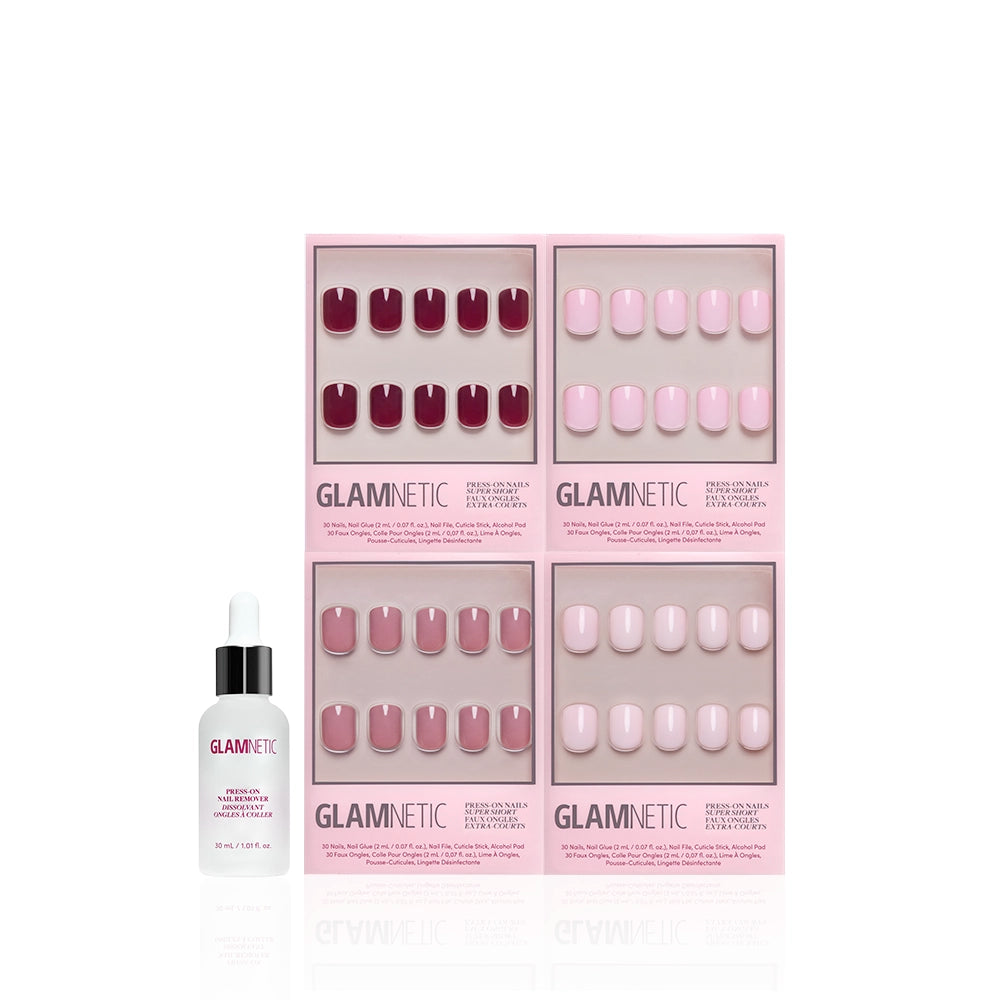 The Pink Super Short Icons by glamnetic: a set of four boxes of pink and mauve press-on nails, shown with glamnetic nail glue (dropper bottle) against a white background. Achieve glossy pink nails at home with this collection. - Product image