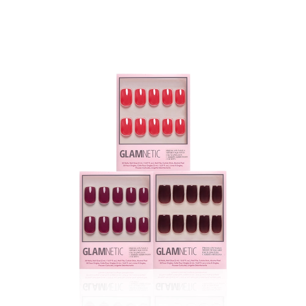 Three boxes of glamnetic Red Hot Squovals press-on nails in shades of pink, purple, and deep red are arranged on a white background. Each box displays a set of ten short squoval nails in a gradient of similar colors. - Product image