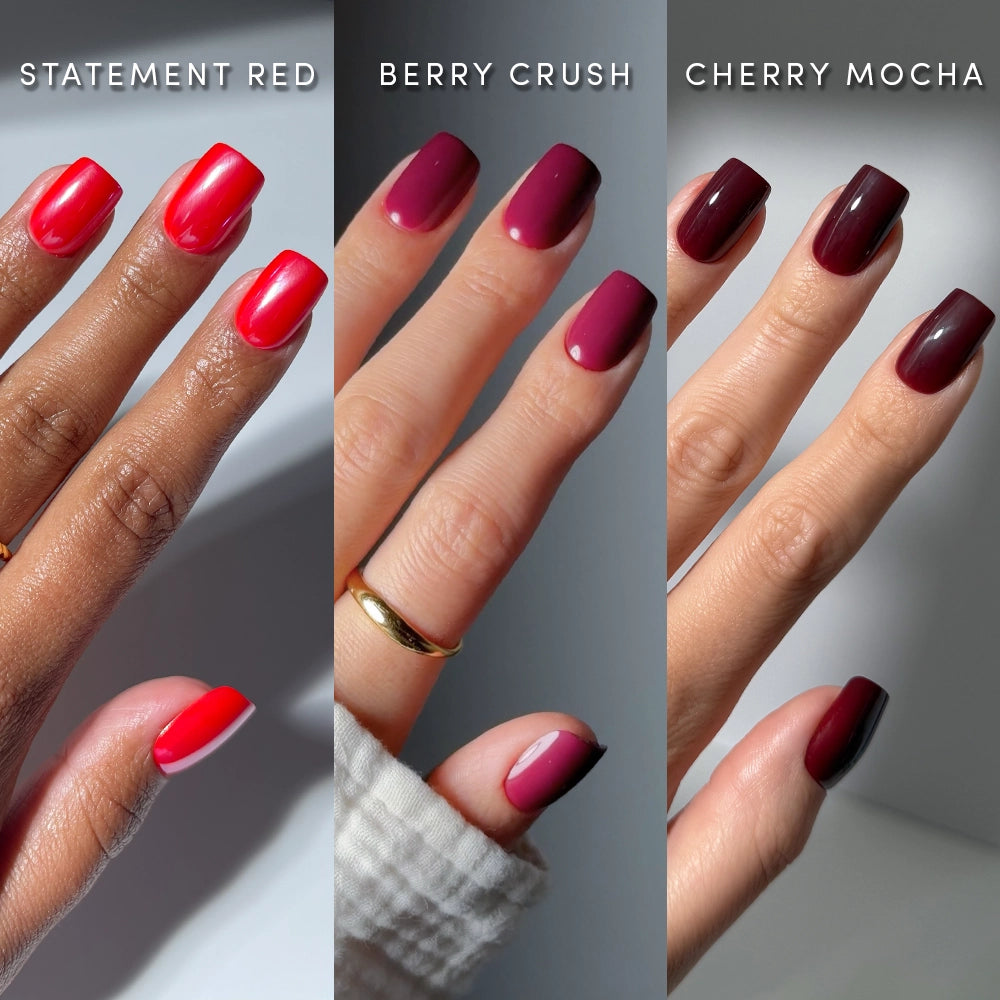 Three hands each display glossy, short squoval nails in different shades: bright red (Red Hot Squovals), deep berry, and dark burgundy. Each vibrant color is labeled above the corresponding hand, perfectly showcasing these stunning glamnetic press-on nails.