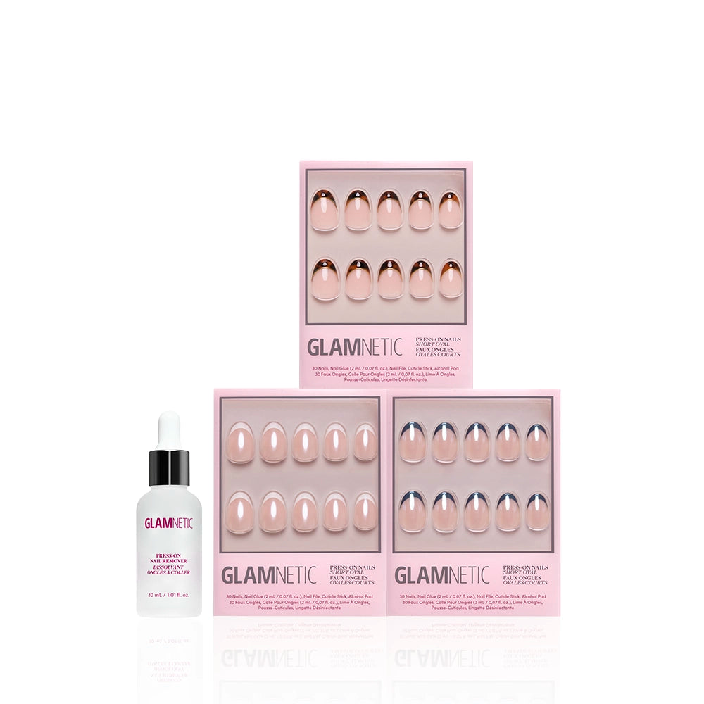 Three boxes of glamnetic The Short Oval Frenchies press-on nails in nude shades are stacked next to a small bottle of glamnetic Cuticle Oil—all in pink packaging on a white background. - Product image