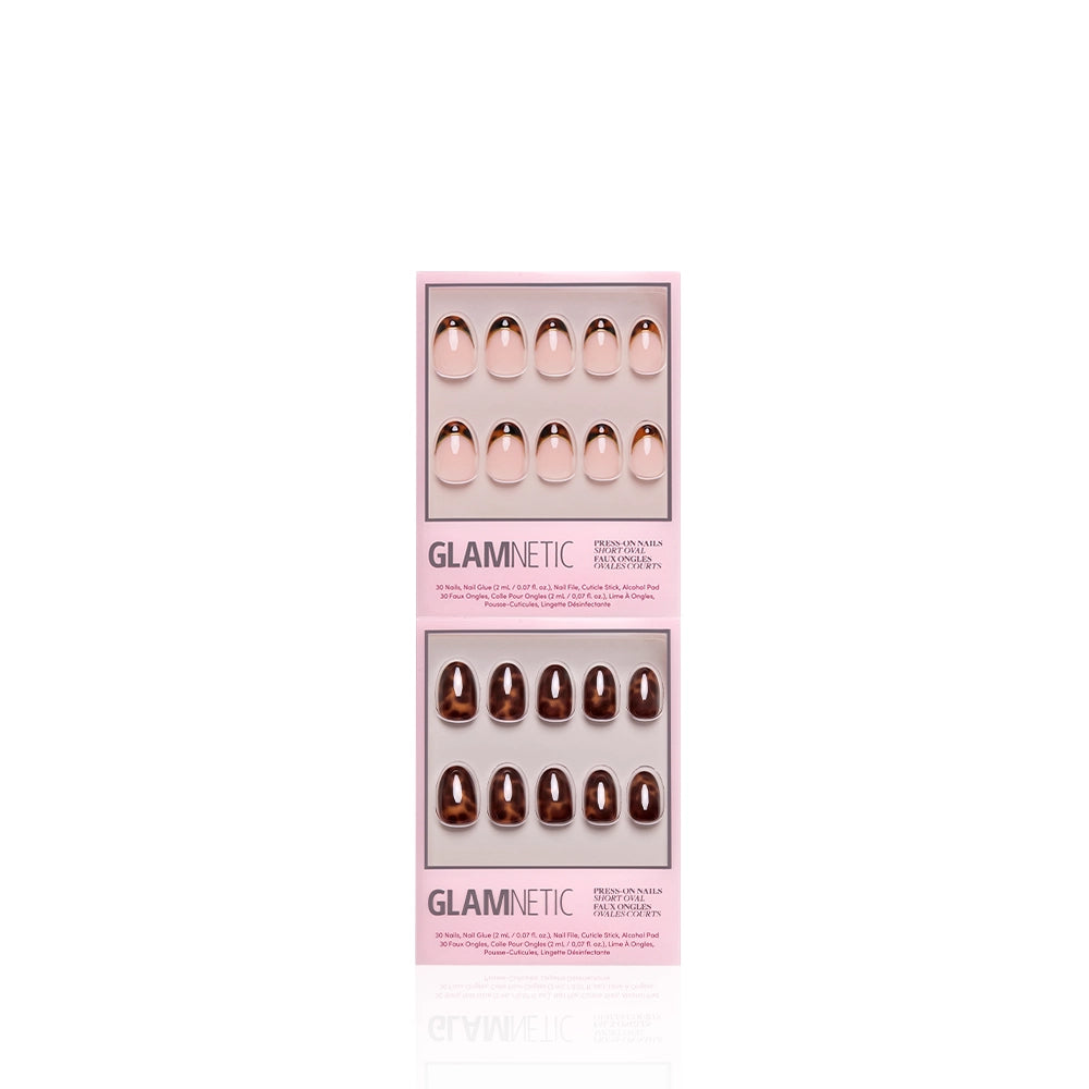 Two boxes of glamnetic's The Short Oval Tortoiseshell Duo, each containing ten short oval press-on nails in ombre nude and brown shades, are displayed in pink packaging against a white background. - Product image
