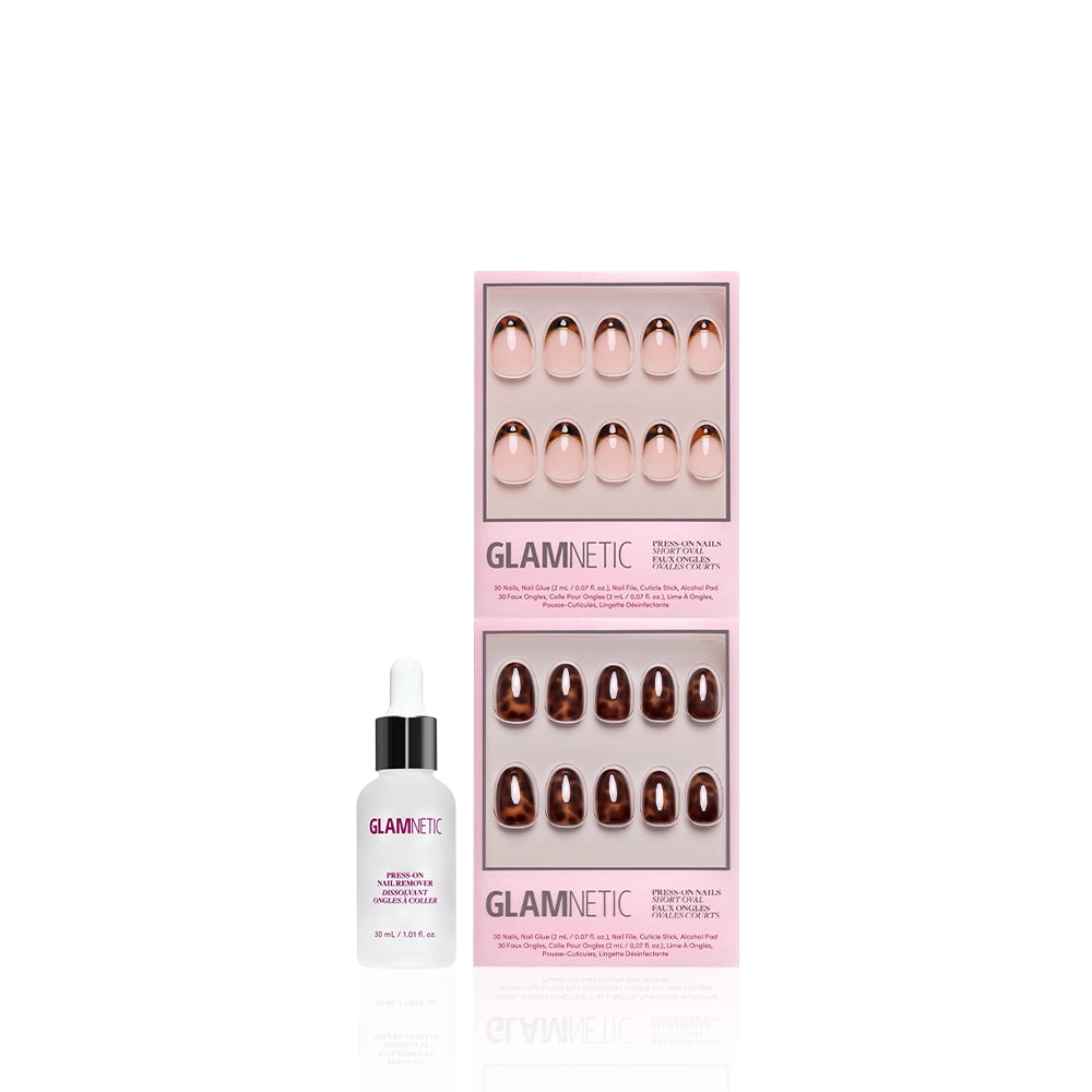 A white Glamnetic dropper bottle sits beside The Short Oval Tortoiseshell Duo magnetic press-on nails in nude and brown shades, both in pink packaging, against a white background. - Product image