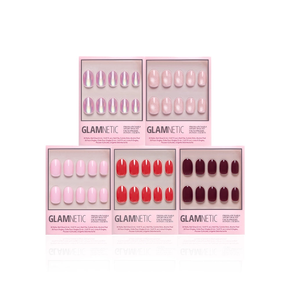 Five sets of glamnetic's The Short Round Edit press-on nails in pink boxes, showcasing glossy pink, red, and burgundy shades. Arranged in two rows on a white background, these short round nails are perfect for achieving a chic look.