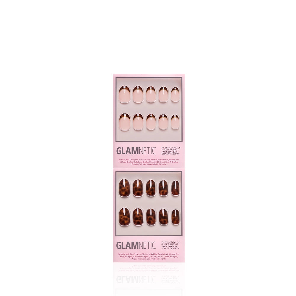 Two boxes of glamnetic’s The Short Round Tortoiseshell Duo are displayed: the top box has shiny nude pink nails, and the bottom features short round brown and tan tortoiseshell nails, both in the brand's signature pink packaging. - Product image