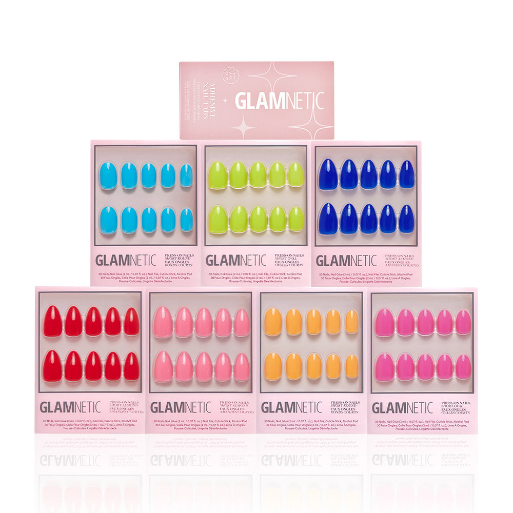 Eight boxes of glamnetic’s Summer Vivids Collection press-on nails are stacked in a pyramid, topped with a pink glamnetic sign. Each box reveals vibrant, colorful nail sets in bold, eye-catching shades. - Product image