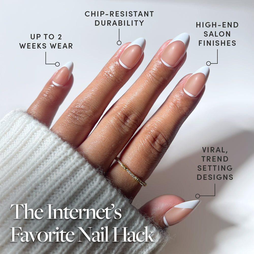 A hand flaunts glamnetic's Class Act French tip press-on nails—the Internet’s Favorite Nail Hack—with up to 2 weeks wear, chip-resistant durability, salon-quality finish, and viral trend-setting vegan designs. - Product image