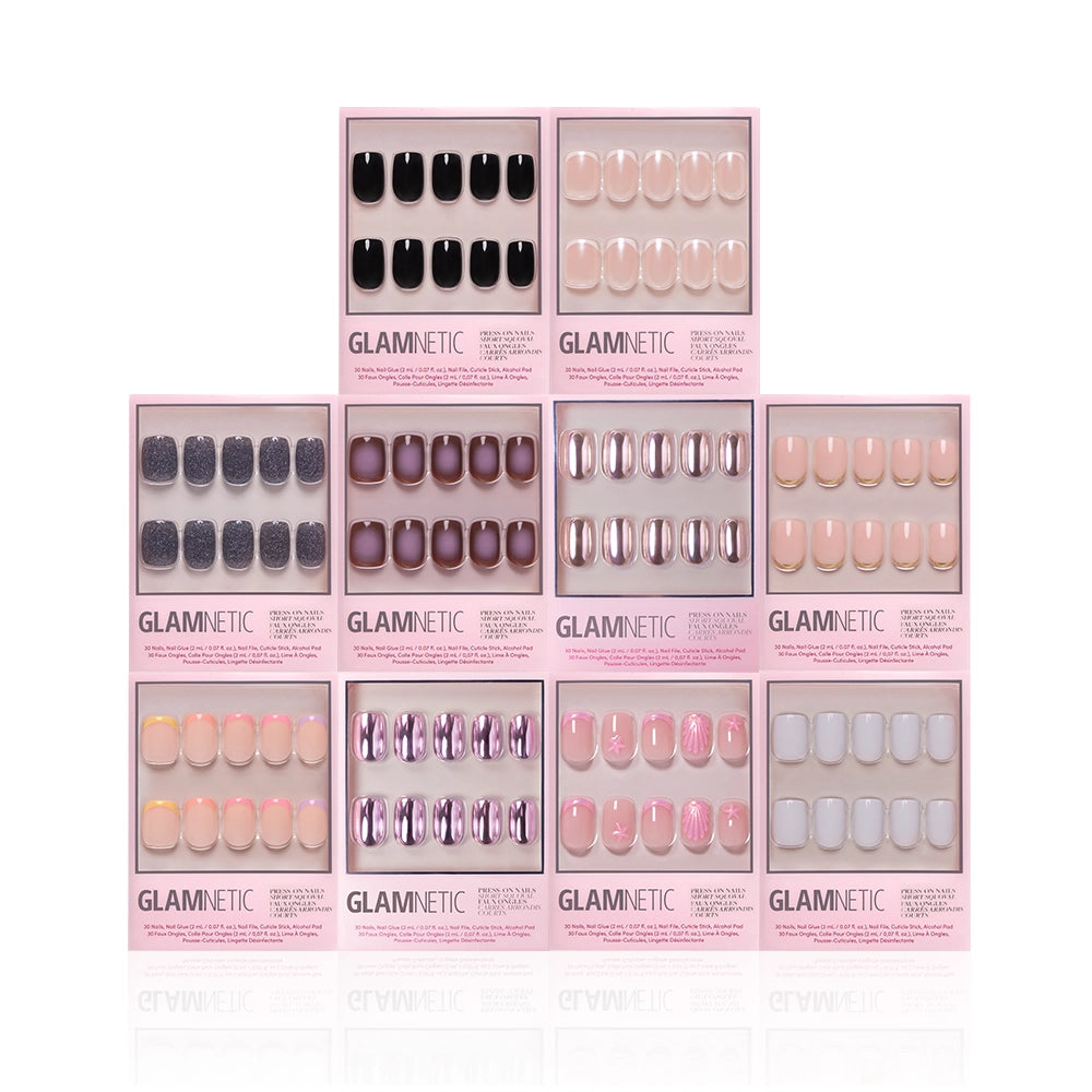 Ten boxes of glamnetic’s The Squoval Vault press-on nails, arranged in a pyramid, showcase various colors and designs—black, pink, purple, metallic, glitter, ombre styles—plus French tip and short squoval options. - Product image