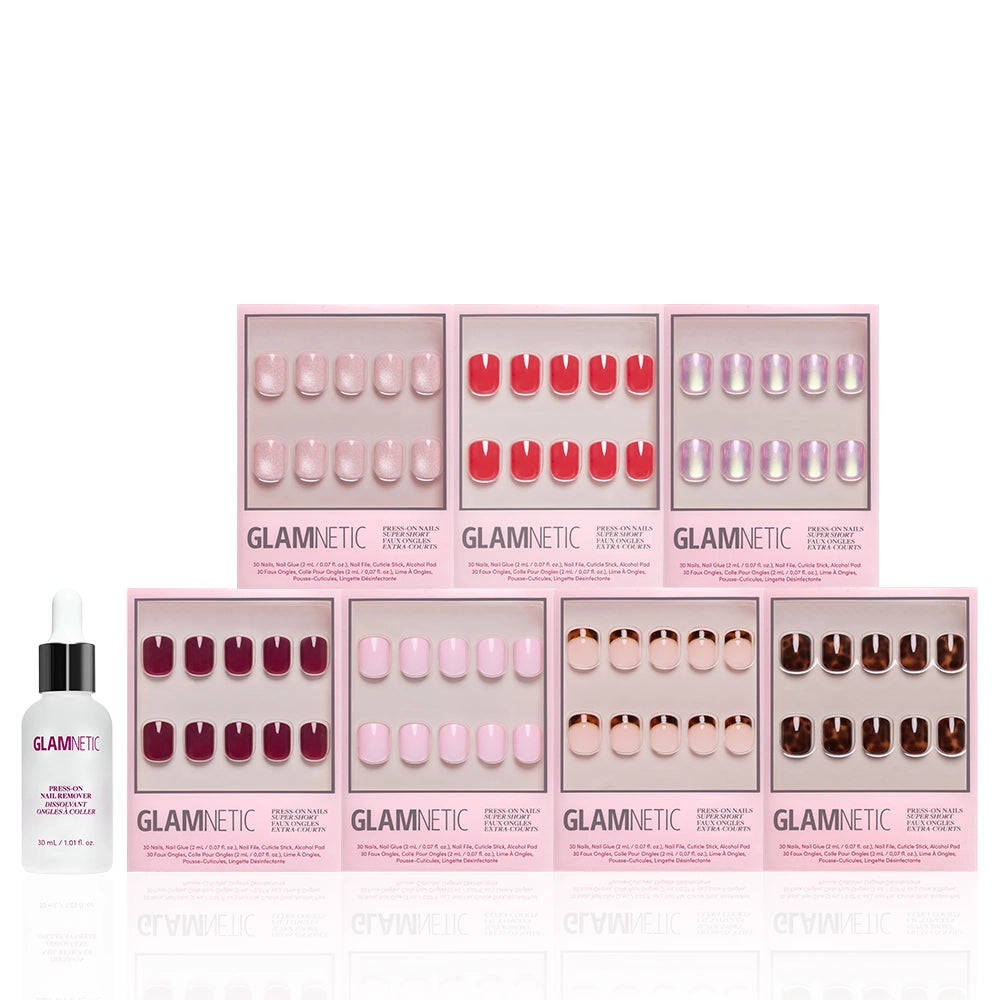 Eight boxes of glamnetic’s The Super Short Edit press-on nails in assorted colors and styles are arranged in two rows, with a nail glue dropper bottle on the left—an ideal bundle for instantly flawless tips. - Product image