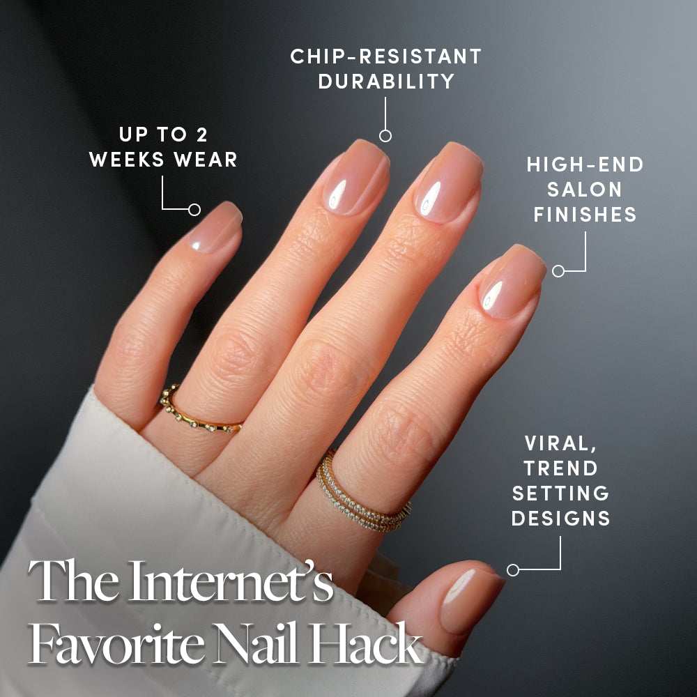 A hand with neatly manicured, nude-colored short squoval nails showcases glamnetic's THRILLA IN MANILA, featuring rings on two fingers. Enjoy up to 2 weeks wear, chip-resistant durability, salon-quality finish, and trendsetting design. - Product image