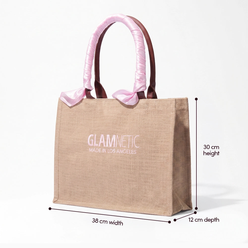 The glamnetic Free Tote Bag ($85+ GWP) is beige with pink satin-wrapped handles and "GLAMNETIC" plus "MADE IN LOS ANGELES" on the front. Size: 38 cm wide, 30 cm high, 12 cm deep. - Product image
