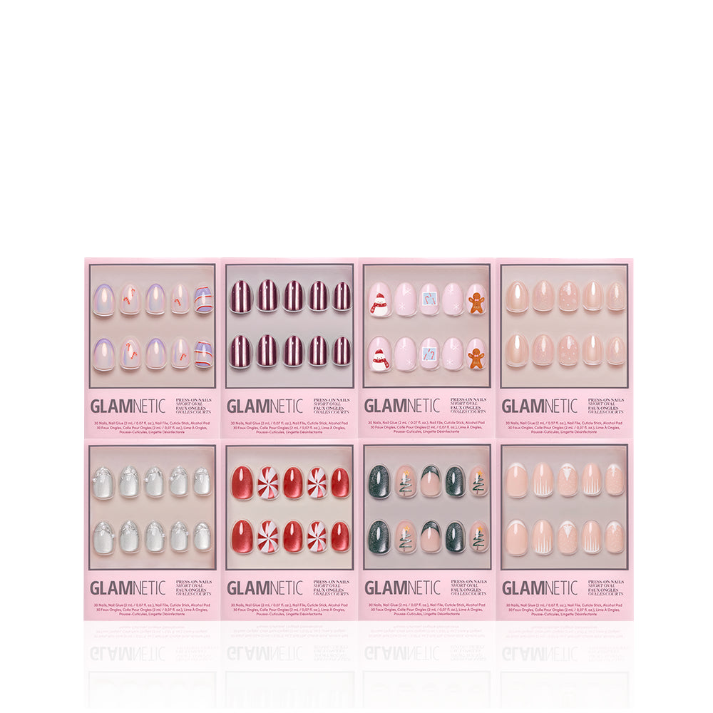 Eight sets of glamnetic Uptown Short Ovals press-on nails in pink boxes, each featuring a unique nail design—such as stripes, holiday themes, gingerbread, peppermint swirls, solid colors, and glittery shimmer styles—are displayed on a white background, perfect for creating your ultimate manicure bundle. - Product image