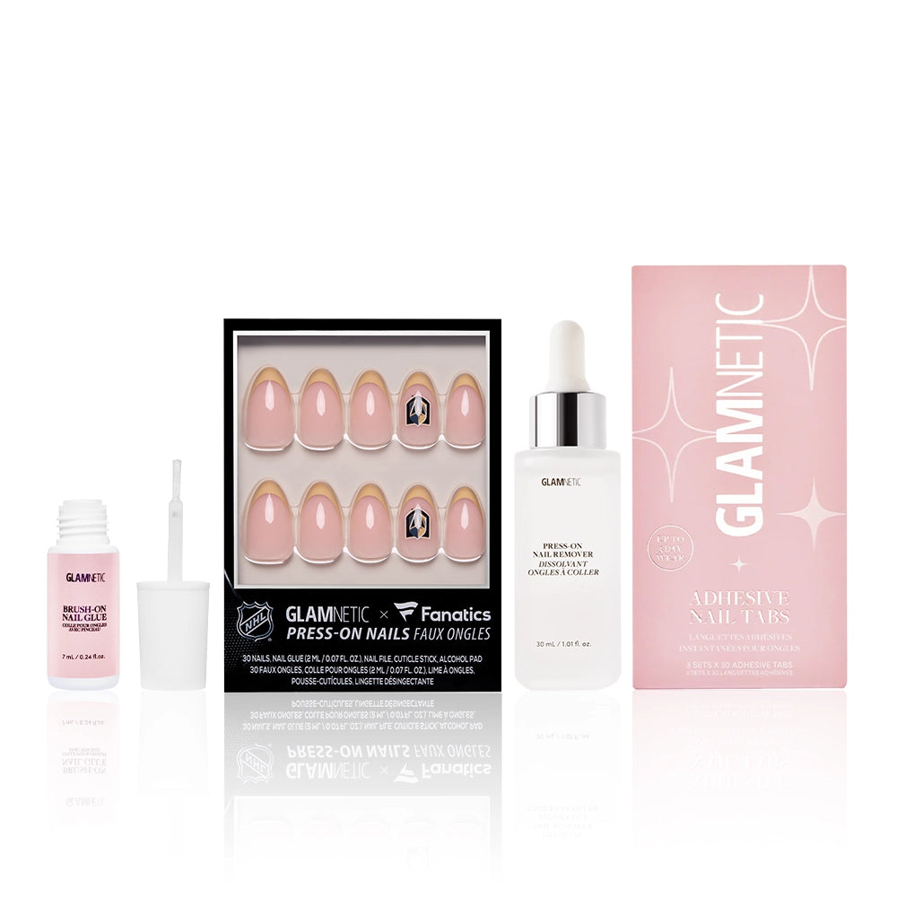 A box of glamnetic&#39;s The Vegas Golden Knights Lineup press-on nails, a small open nail glue bottle, a dropper bottle of glamnetic Press On Nail Cuticle Oil, and a pink glamnetic Adhesive Nail Tabs packet.