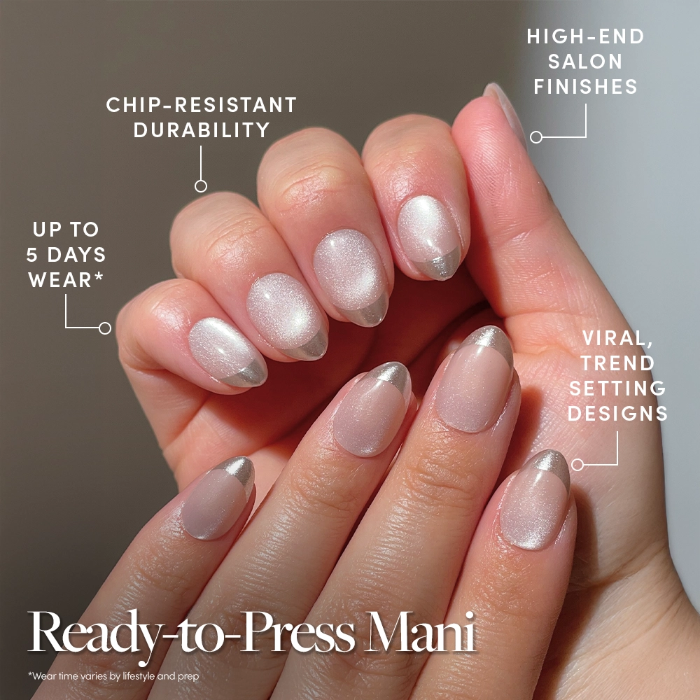 Close-up of hands with Velvet French press-on nails by glamnetic—oval, pearly pink with silver tips. Built-in adhesive for no-glue use, chip-resistant, salon-quality trendy design, and lasts up to 5 days. - Product image