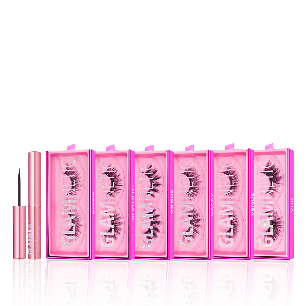Seven pink boxes of glamnetic Vivid Volume vegan lashes are lined up beside a pink tube of black eyeliner with the cap off, all set against a white background. - Product image