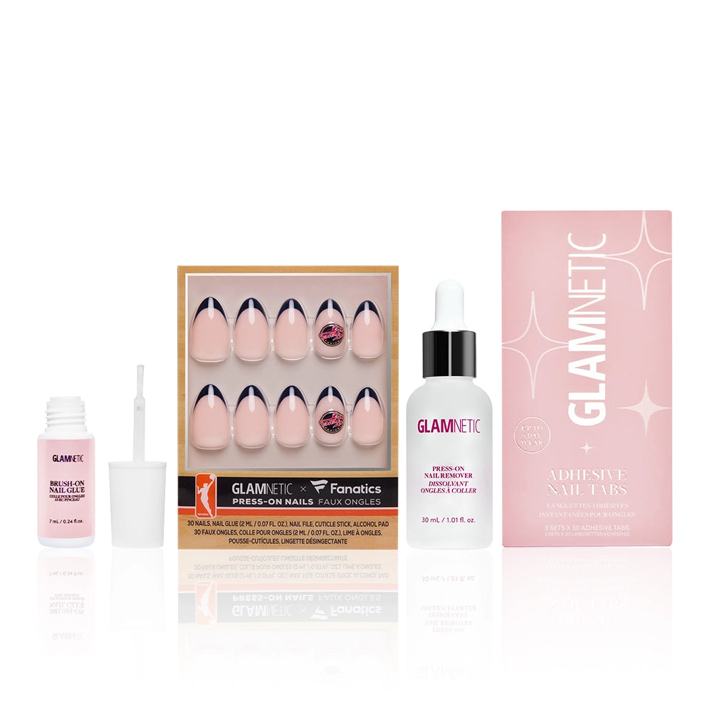 The Indiana Fever Lineup by glamnetic features press-on nails, adhesive nail glue with a brush, press-on nail remover with dropper, and adhesive nail tabs—all in pink packaging.